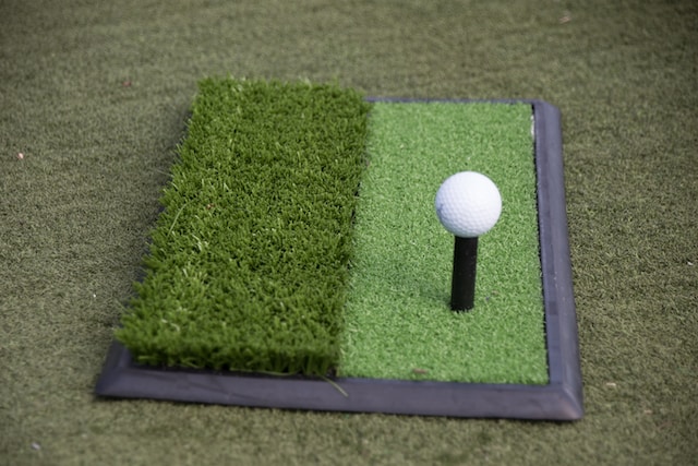 golf-ball-on-a-plastic-tee-at-a-driving-range