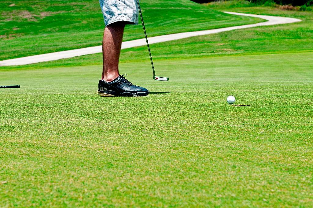 man-standing-on-green