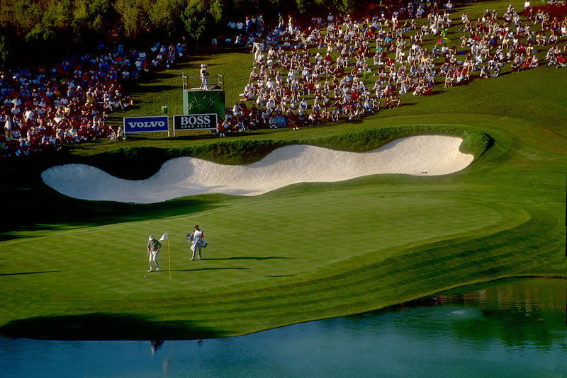 two-golfers-walking-across-field