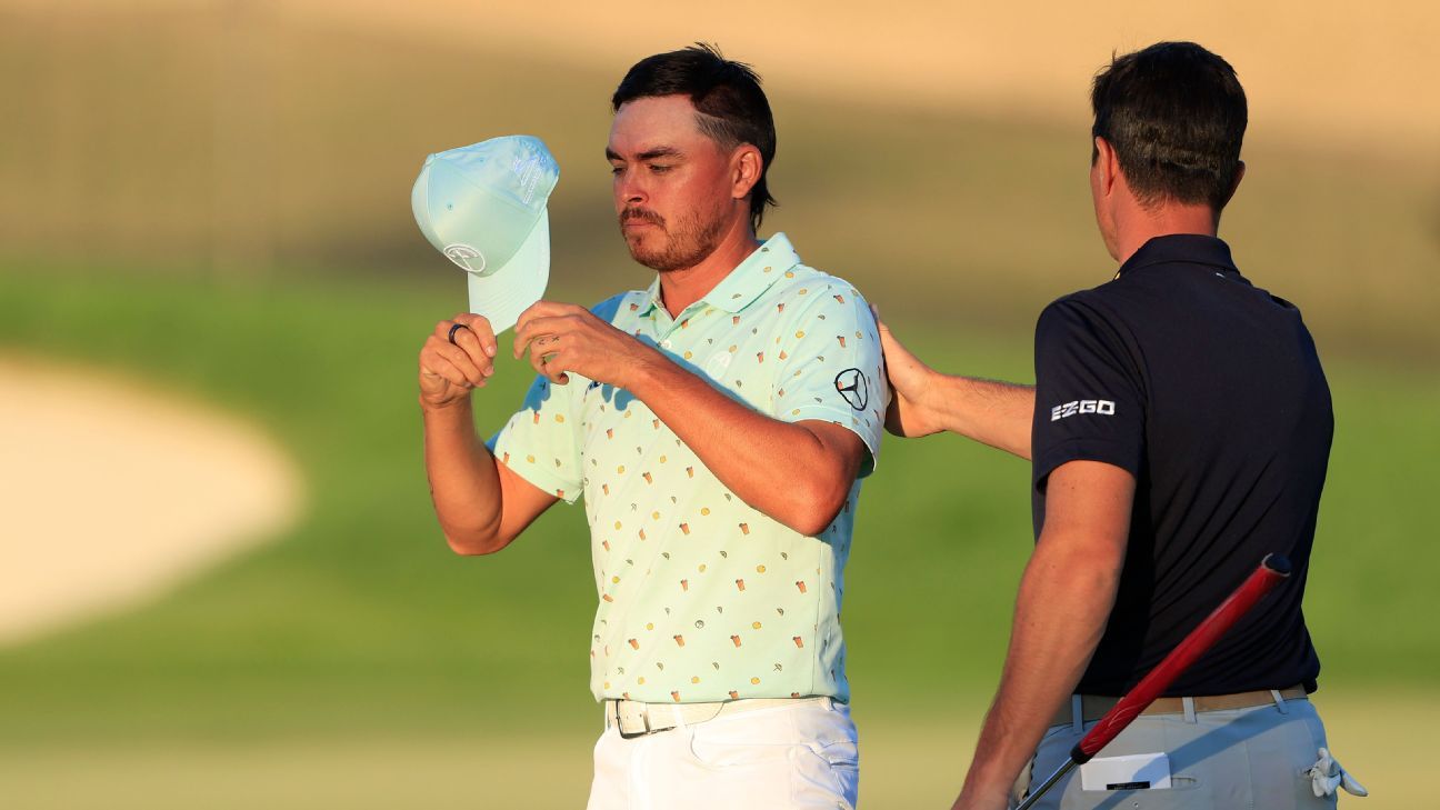 man-patting-rickie-fowler-on-the-back