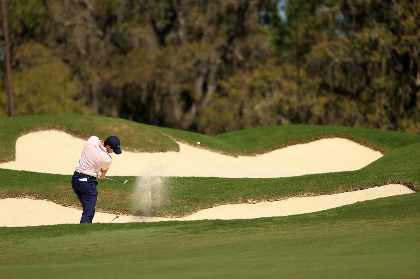 Master golf bunker shots using an 8-iron & learn pro techniques for better club control, versatility, and skill enhancement on the course.