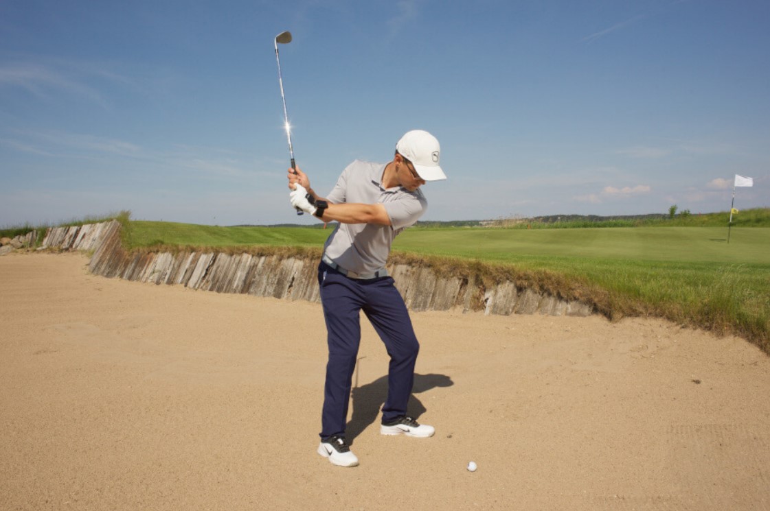 Master bunker shots with pro tips on using an 8-iron and maintaining an open clubface for improved golf game and finesse